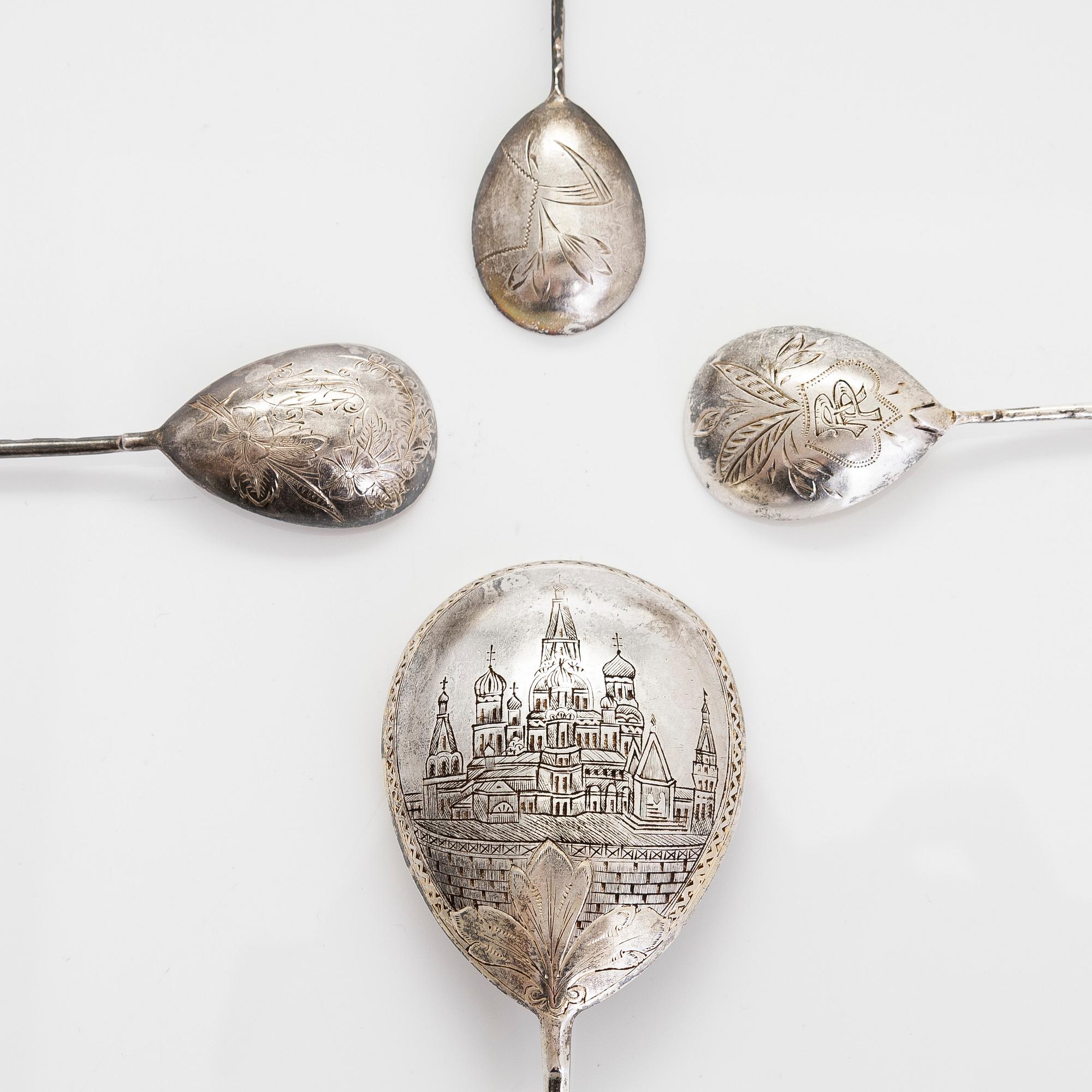 Three silver tea glass holders and four spoons, silver Kostroma and Moscow, late 19th and early 20th centuries.