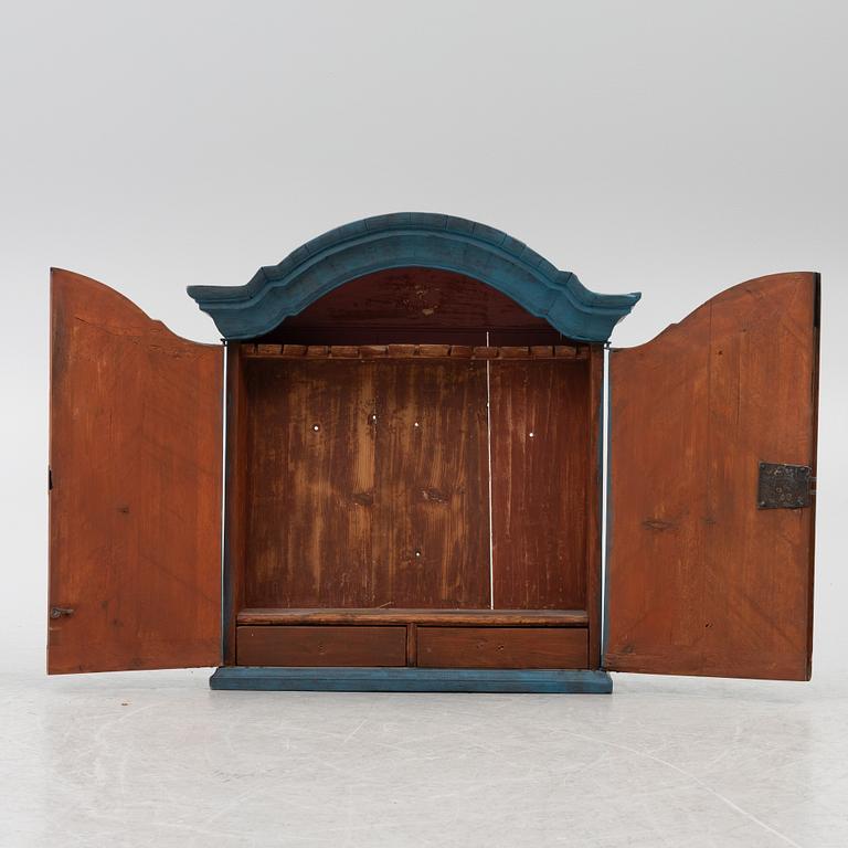 A wall cabinet, 18th century.
