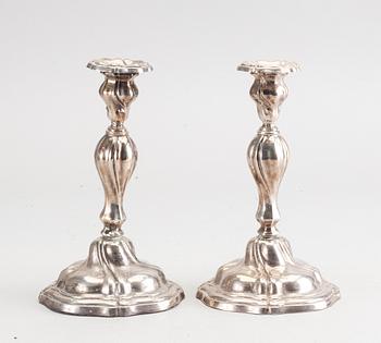 A 20th century pair of silver candle sticks rococo-style, height ca 22 cm.