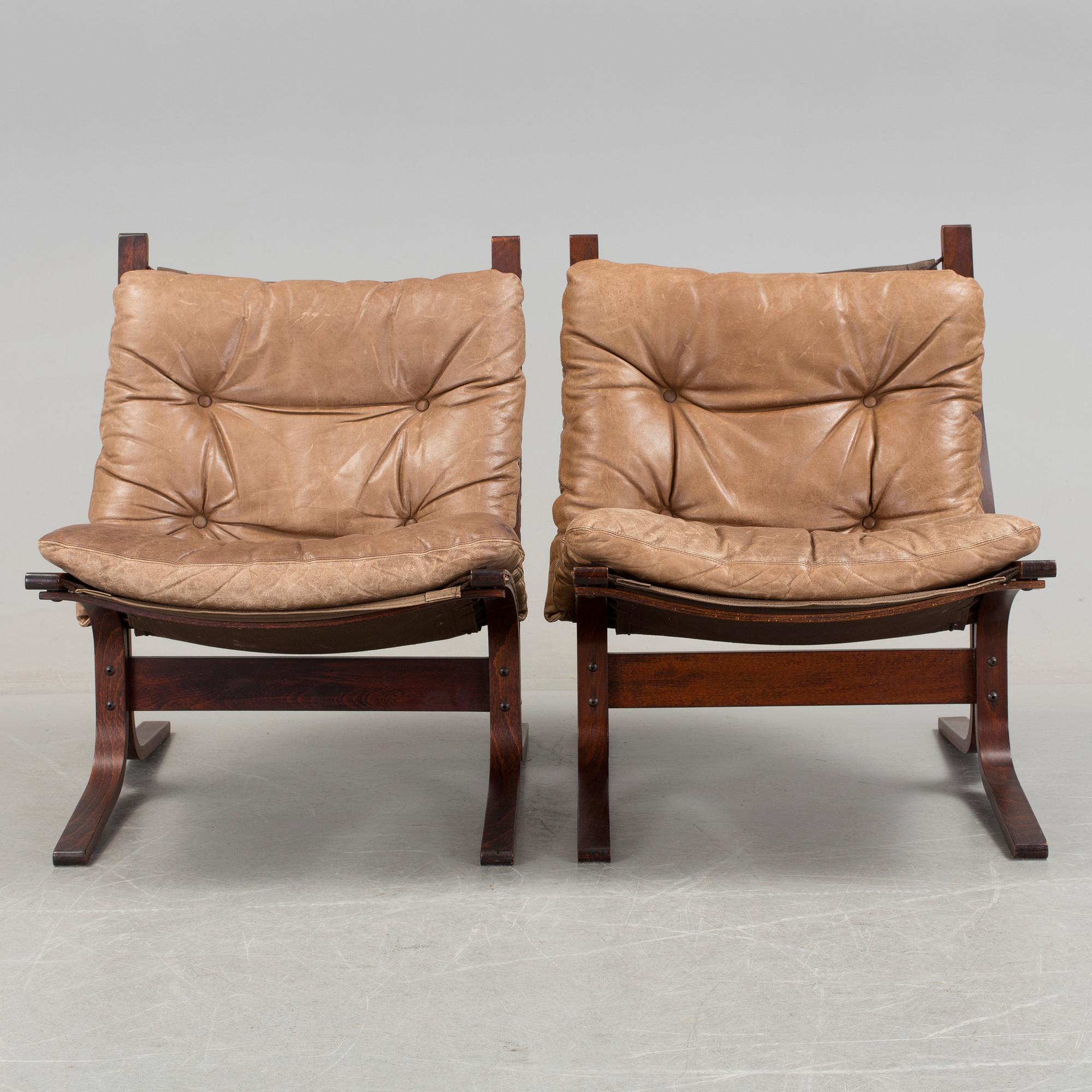 A pair of 1970s "Siesta", easy chairs and sofa tables by Ingmar Relling, Norge.