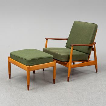 A 1950's beech and teak model FD 161 easy chair with stool by Arne Vodder for France & Son.