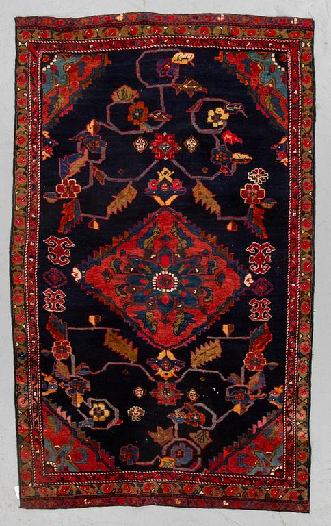 A rug, semi-antique Kurdish, ca 194 x 112 cm.