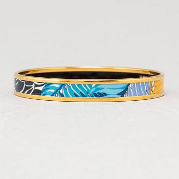 HERMÈS, a metal and enamel bangle.