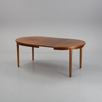 A mahogany veneer dining table, second half of the 20th century.