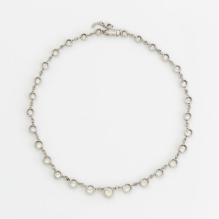 A platinum necklace set with old-cut diamonds.