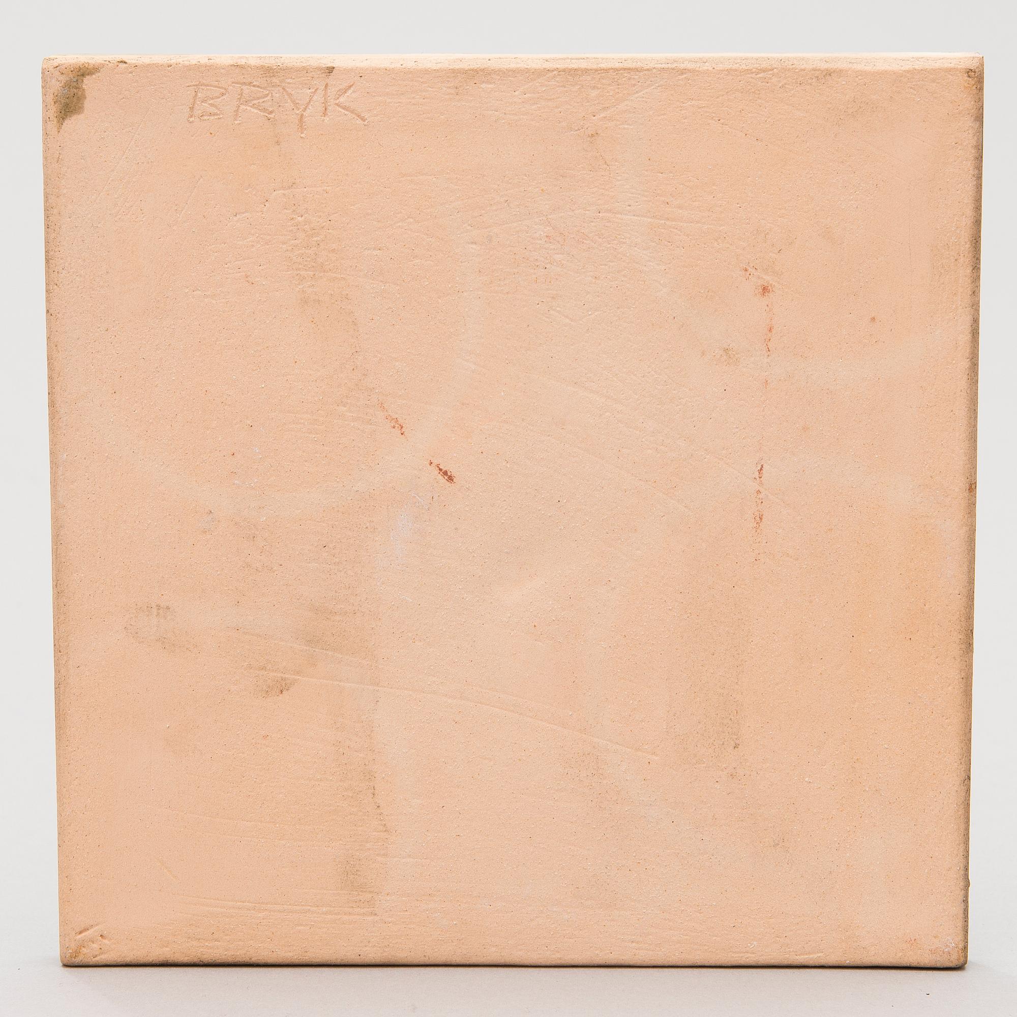 A stoneware relief signed BRYK.