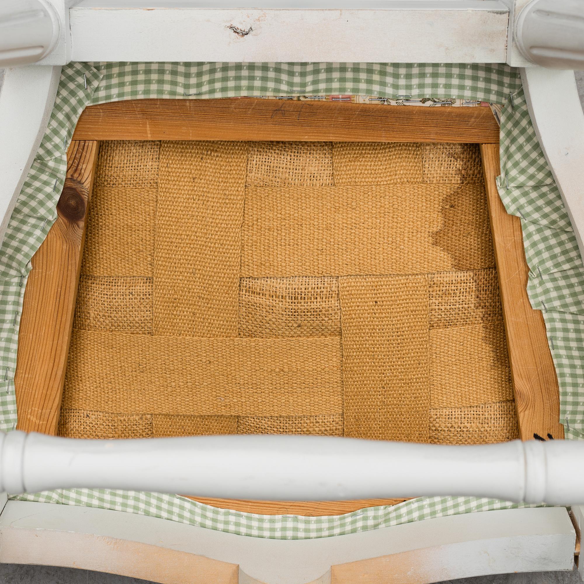 A Gustavian style dining table and ten chairs, 20th century.