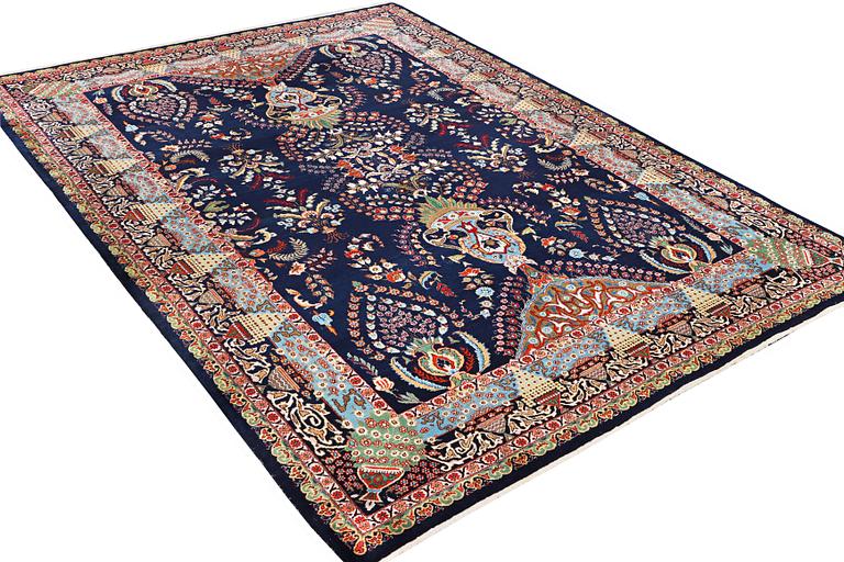 A Kashmar carpet, c. 356 x 260 cm.