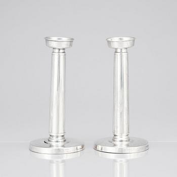 Gustaf Janson, a pair of sterling candlesticks, C.G Hallberg Stockholm 1961.