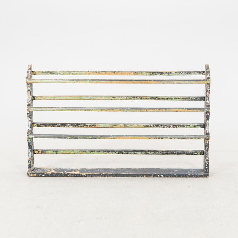 A painted early 1900s shelf.