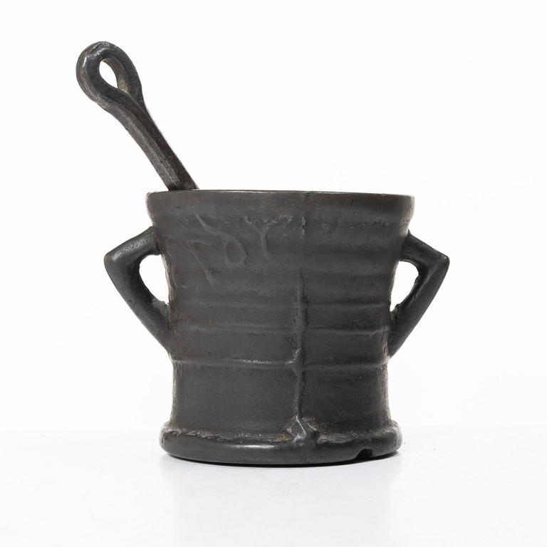 Mortar and pestle, dated 1673.