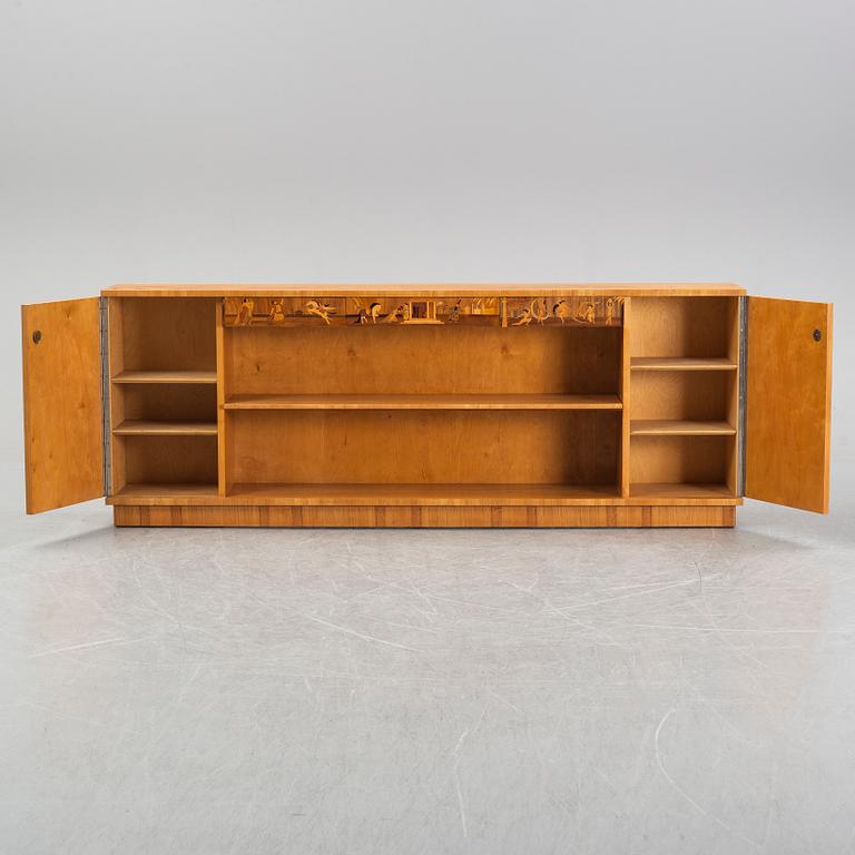 An inlaid bookcase from Mjölby Intarsia, 1930's.