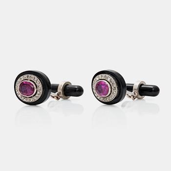 469. A pair of cufflinks with Burmese rubies, onyx and rose-cut diamonds. Certificate by GCS.