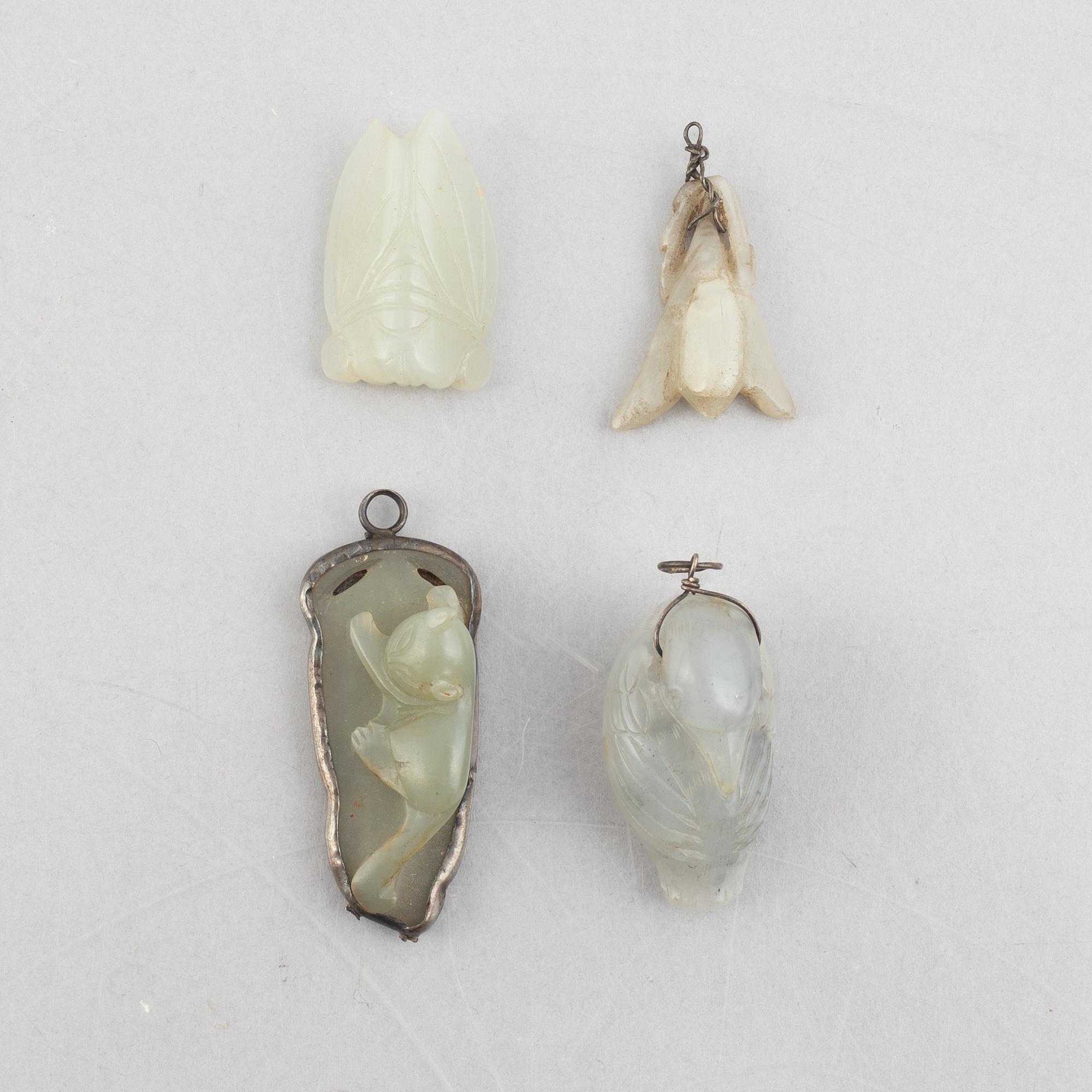 A group of eight Chinese stone charms / pendants, 20th century.