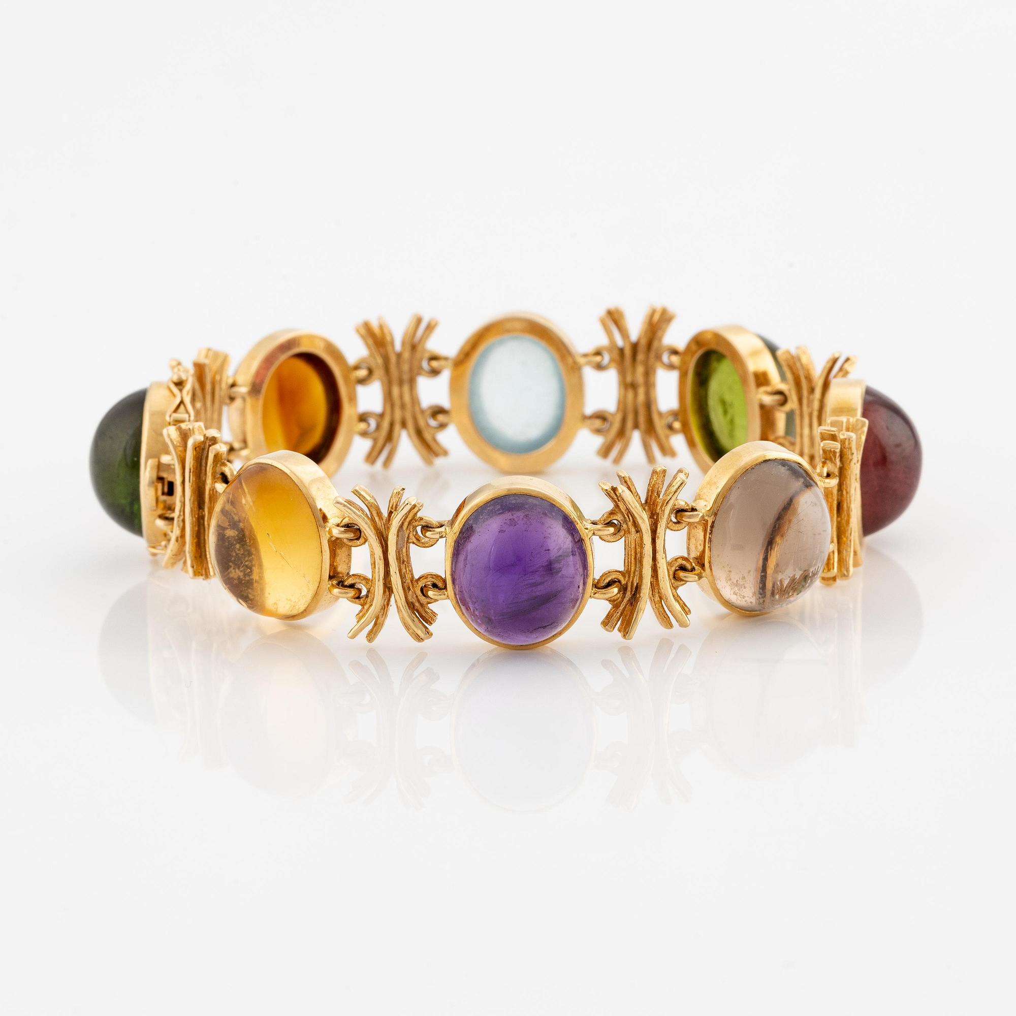 W.A. Bolin, design Barbro Littmarck, armband, 18K guld med cabochonslipade färgstenar, Stockholm 1970.