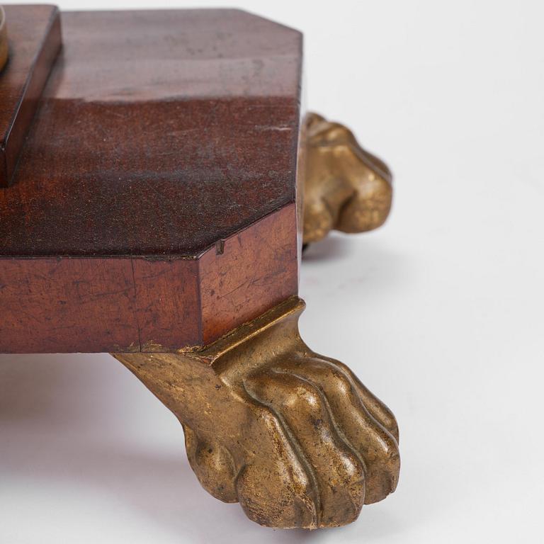 A Swedish Empire mahogany center table.