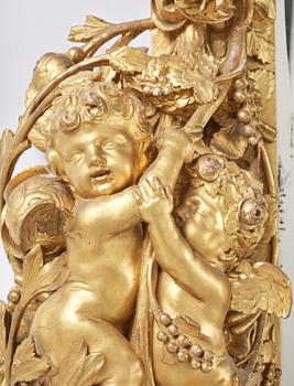 A presumably Dutch Louis XIV carved giltwood frame with mirror glass, in the style of Jean Le Pautre, late 17th century.