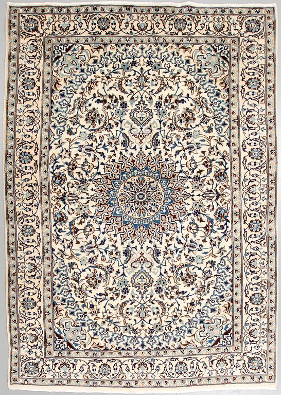 A Nain rug, part silk, 290 x 195 cm.