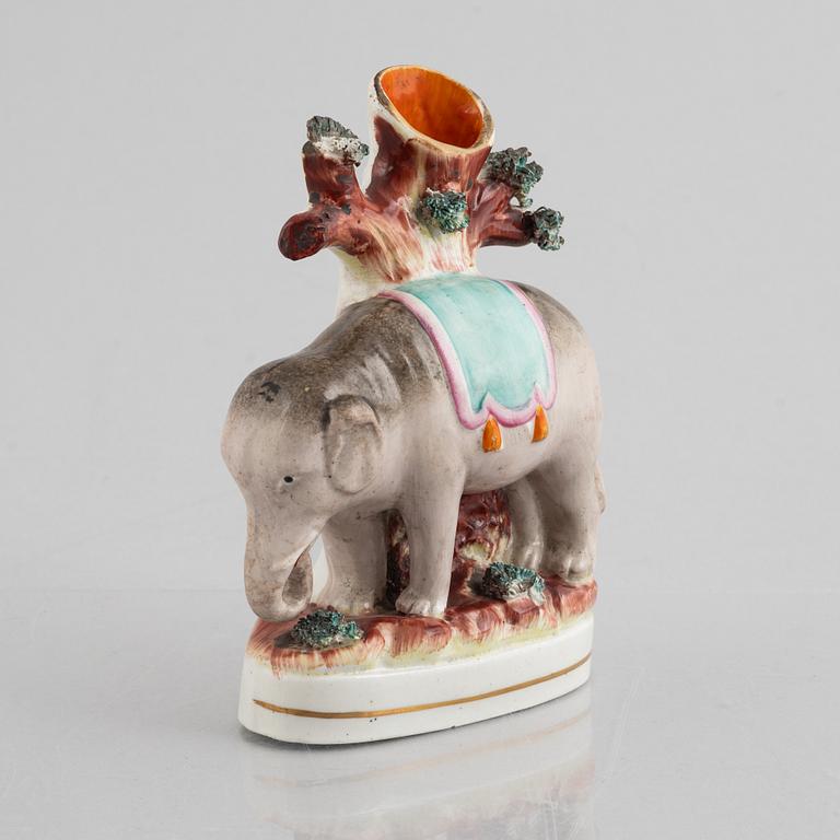 An elephant spill vase, Staffordshire, England, 19th century.