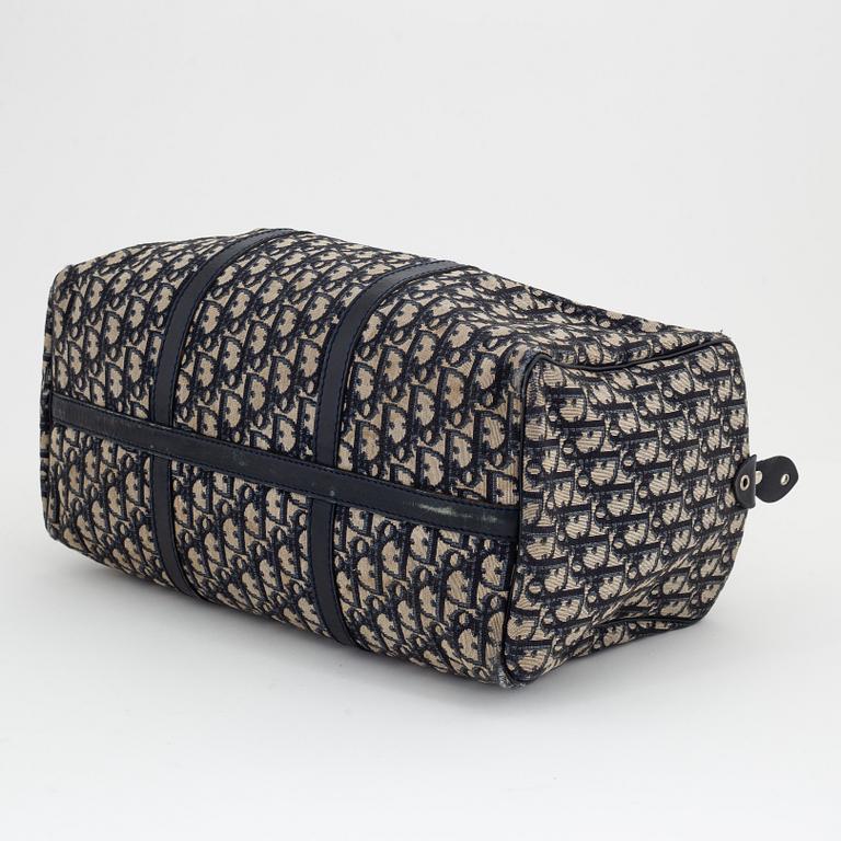 Christian Dior, a canvas handbag, toilet bag and key holder.