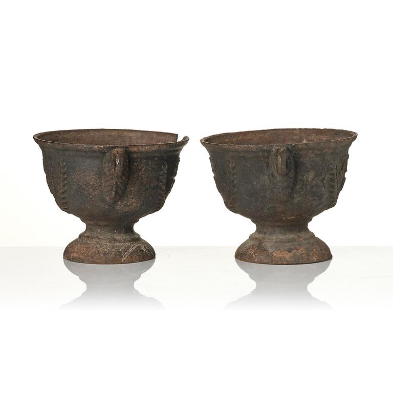 A pair of cast-iron garden urns, presumably from Näfveqvarns styckebruk, dated 1789.