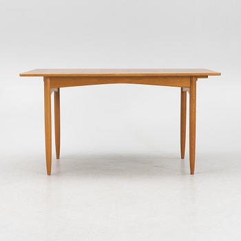 A teak and oak dining table, Scandinavia, 1960's.