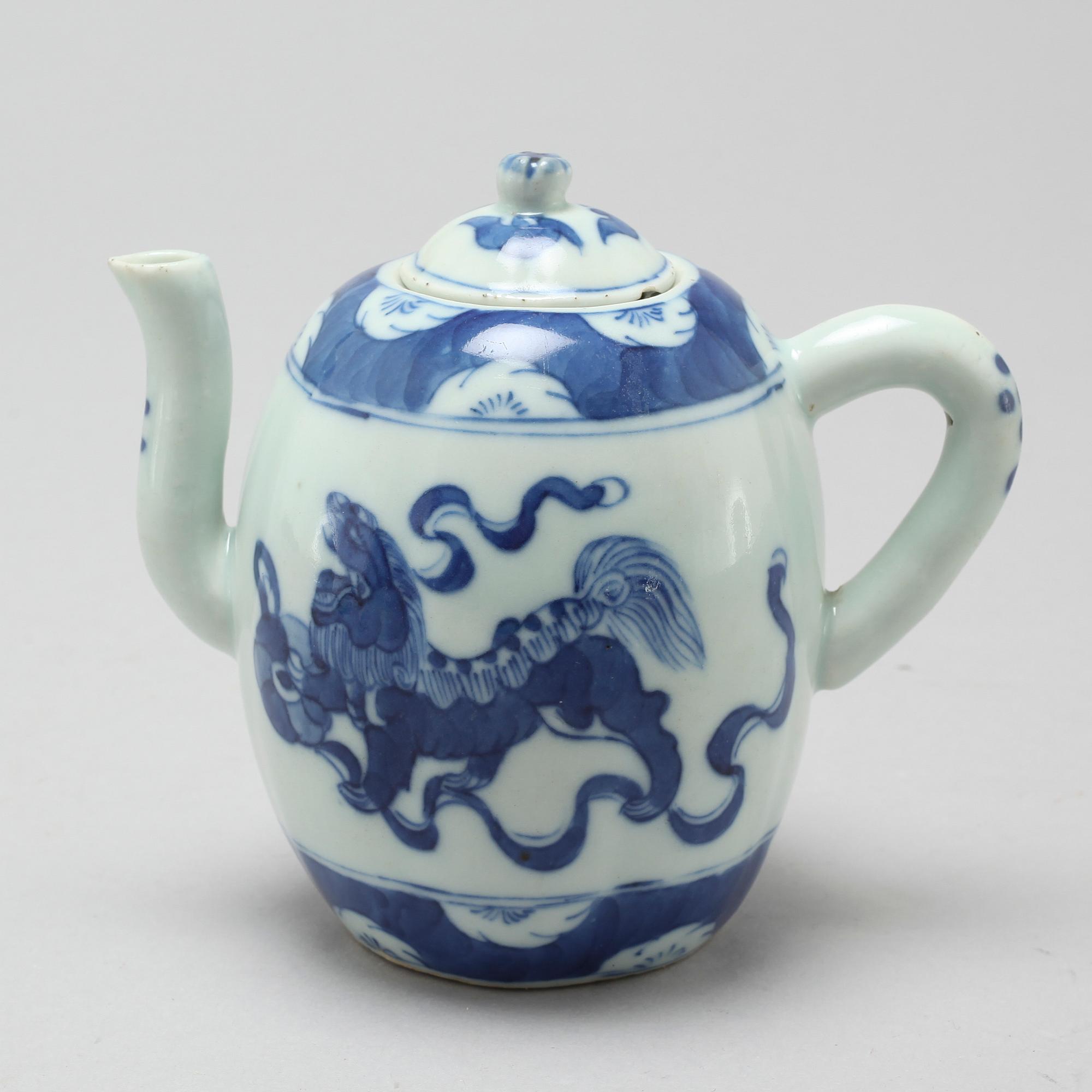 A 20th century porcelain tea pot.