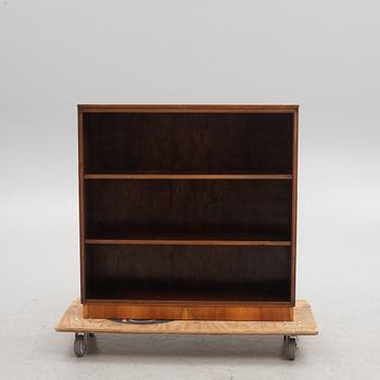 A 1930s wanlut and rosewood veneered  bookcase.