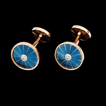 1135. A pair of blue enamel and diamond cufflinks.