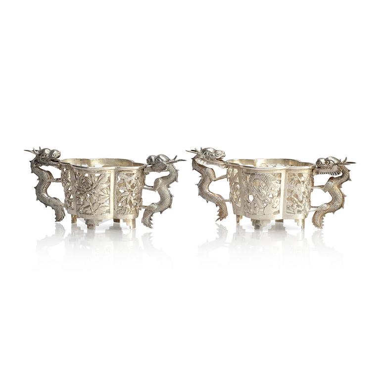 A pair of  Chinese silver cup holders, 20th century.