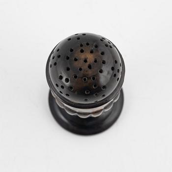 A 18th Century horn saltshaker.