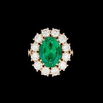 998. An emerald, 6.37 cts, and brilliant-cut diamonds, total carat weight circa 2.89 cts, ring.