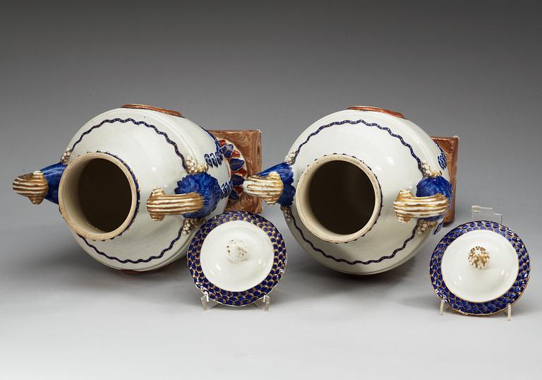 A pair of famille rose vases with covers, Qing dynasty, Qianlong (1736-95).