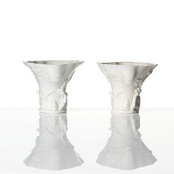A pair of blanc de chine rhinoceros libation cups, Qing dynasty, Kangxi (1662-1722).