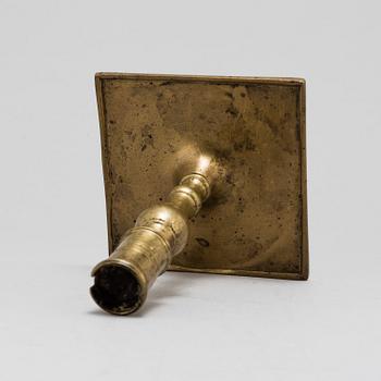 A Baroque brass candlestick, early 18th century.