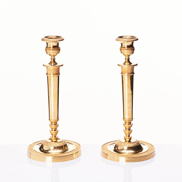 A pair of French Empire candlesticks, early 19th century.