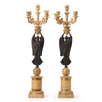 54. A pair of Empire early 19th century five-light candelabra by Pierre Chibout.