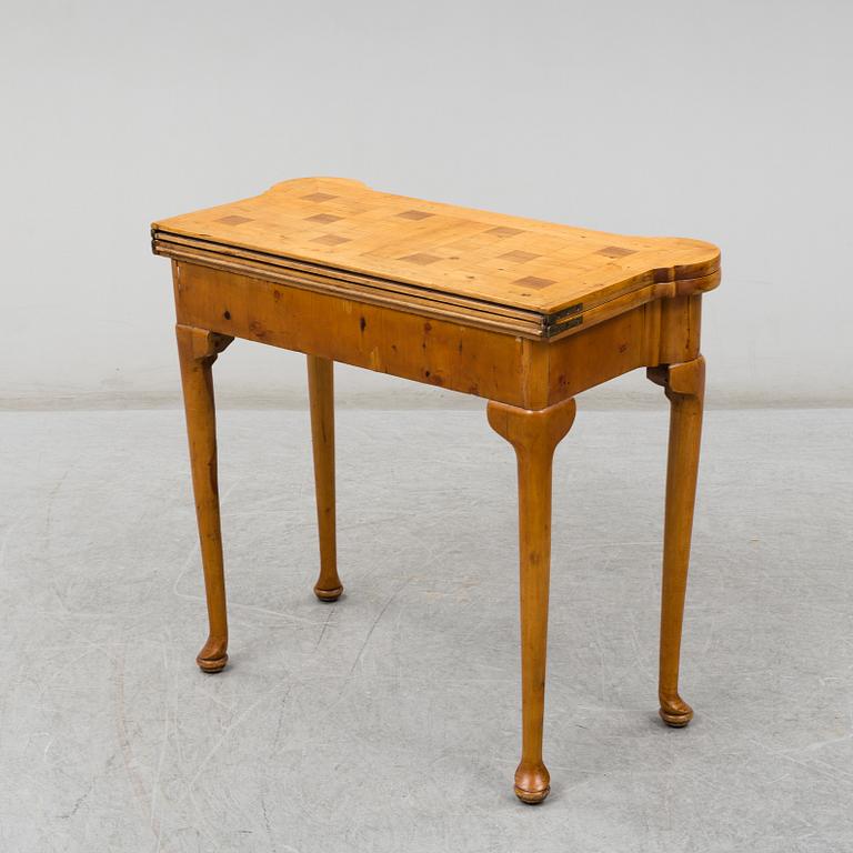 An end of the 19th Century Queen Anne-style card table.