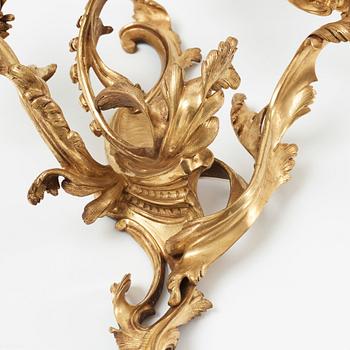 A pair of Louis XV mid 18th century three-light wall-lights.