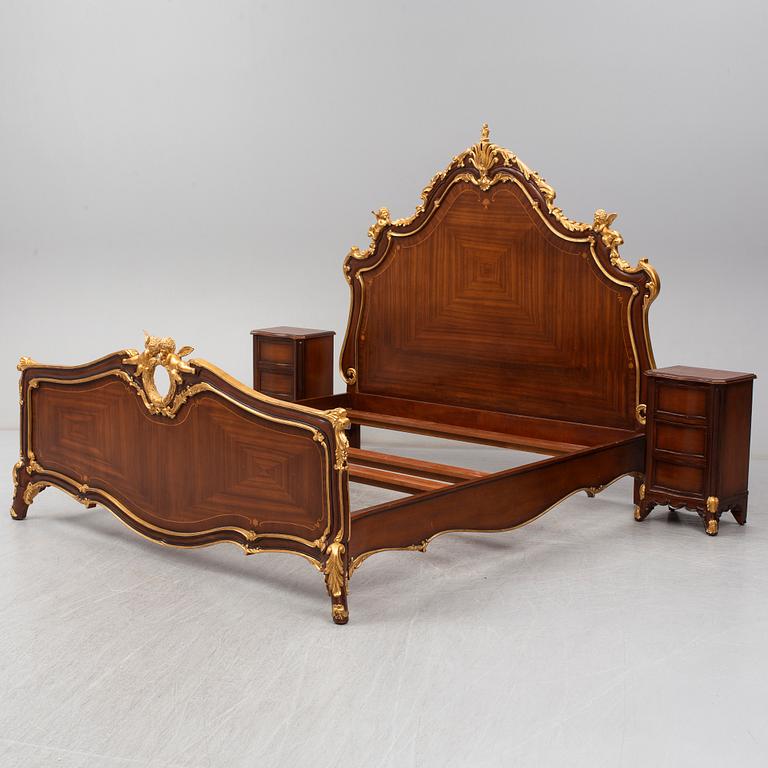 a set of a mahogany veneered and guilded rococo-style bed and two bedside tables.