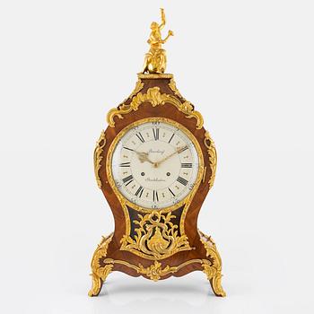 A rococo-style bracket clock, 20th century incorporating older elements.