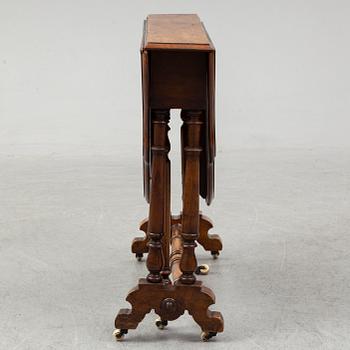 A 19th Century drop leaf table.