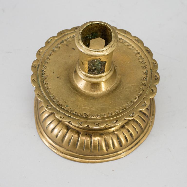 A 16th century bronze candlestick.