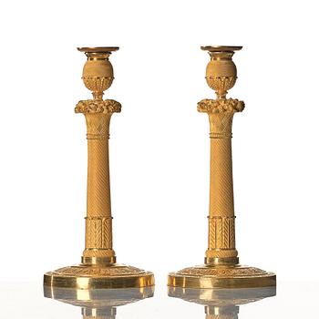 A pair of Empire early 19th century candlesticks.