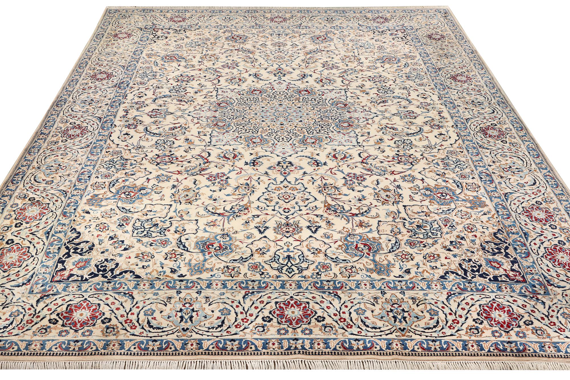 A Nain, part silk carpet, c. 474 x 322 cm.