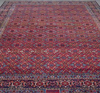 A CARPET, semi-antique Yazd, signed ca 525 x 336 cm.