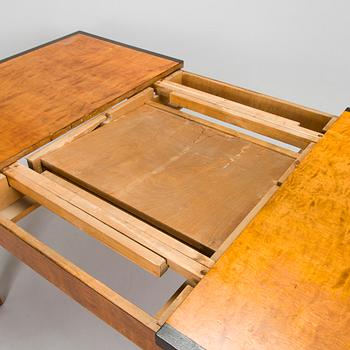 A 1920s/30s century dining table and set of 6 + 2 chairs.