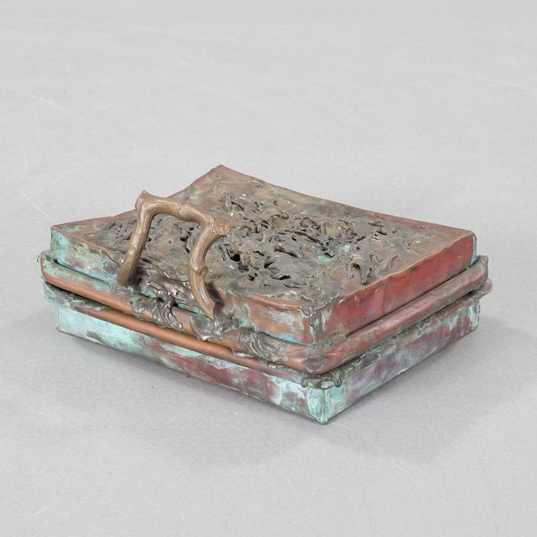 a metal sculpture, signed and dated -83.