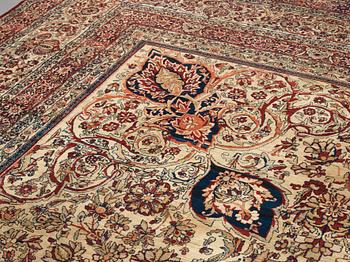 A carpet, an antique Kerman Laver, ca 677-688,5 x 510,5-526 cm.