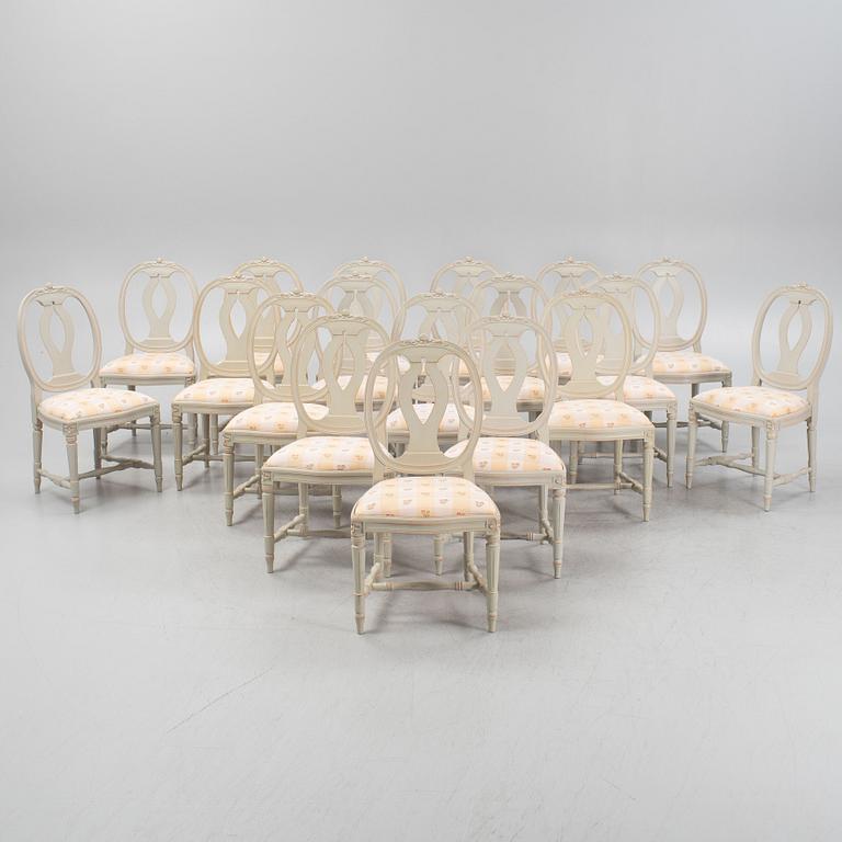 A Gustavian style dining table with 18 chairs.